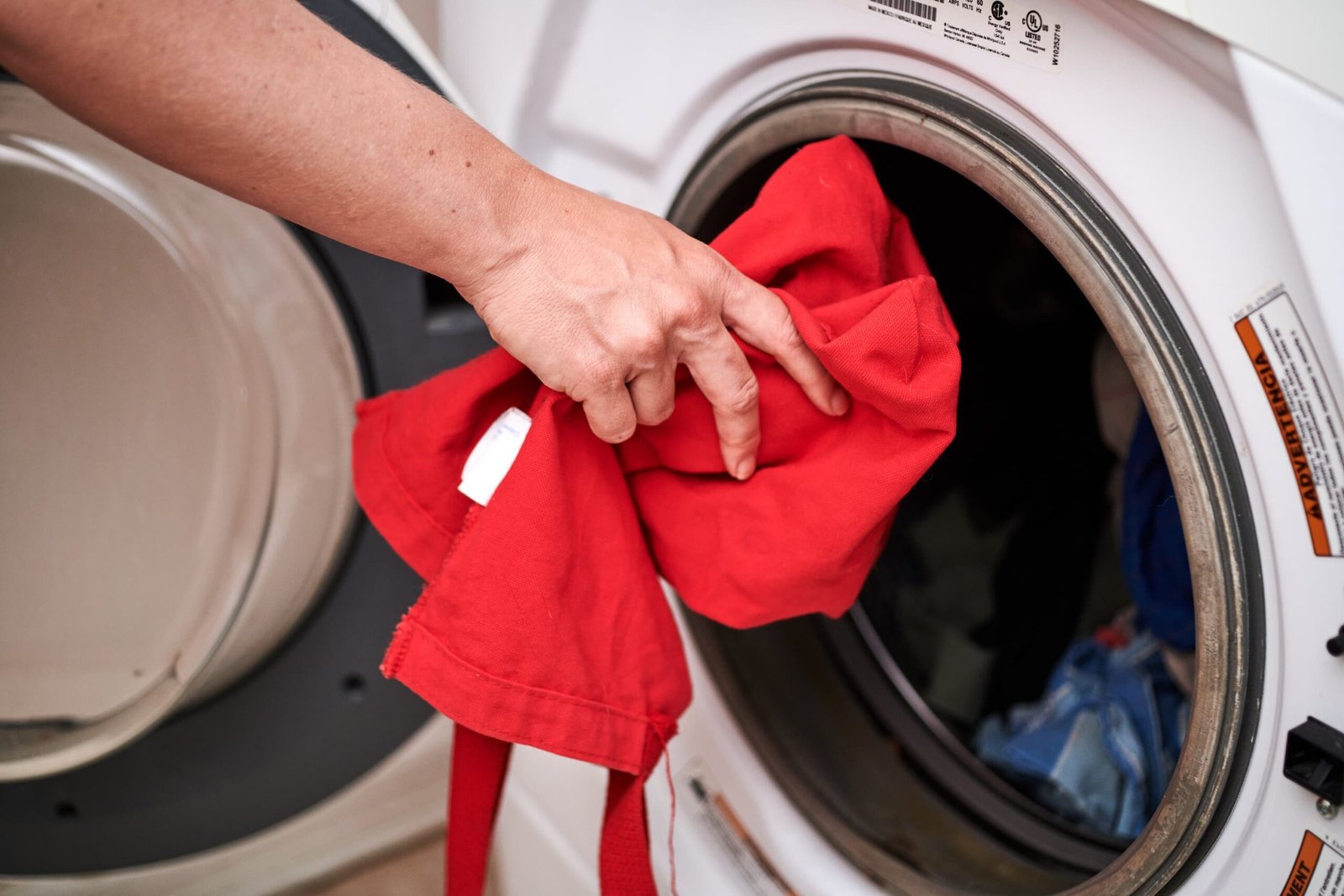 Image of a person cleaning a reusable grocery bag