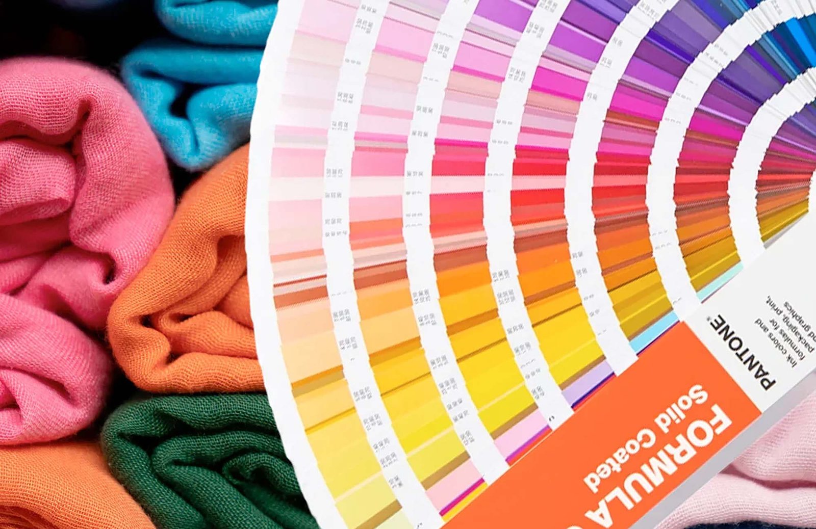 B2B buyer checking fabric swatches with a supplier