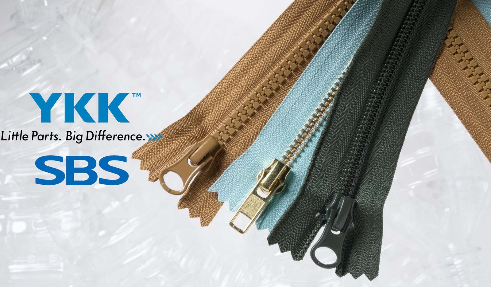 Close up of YKK and SBS zipper sliders